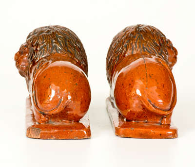 Pair of Glazed Redware Lion Figures, probably PA origin, mid 19th century