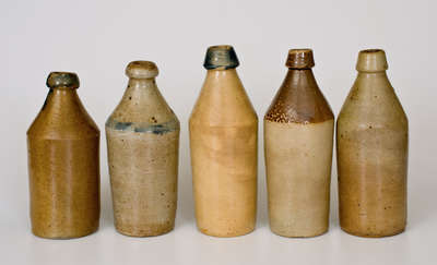 Lot of Five: Fine Stoneware Bottles incl. Dated and Cobalt Decorated Examples