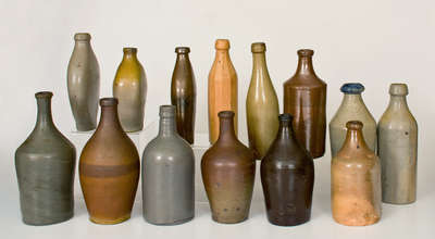 Lot of Fourteen: Stoneware Bottles and Flasks incl. Early Examples