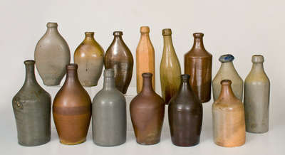 Lot of Fourteen: Stoneware Bottles and Flasks incl. Early Examples