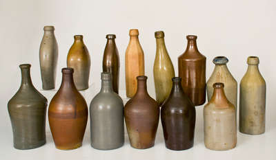 Lot of Fourteen: Stoneware Bottles and Flasks incl. Early Examples