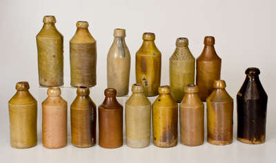 Lot of Fifteen: Stoneware Bottles with Impressed Advertising