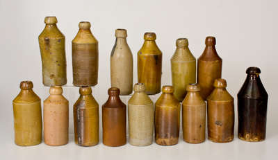 Lot of Fifteen: Stoneware Bottles with Impressed Advertising