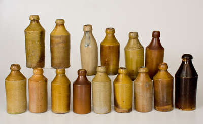 Lot of Fifteen: Stoneware Bottles with Impressed Advertising