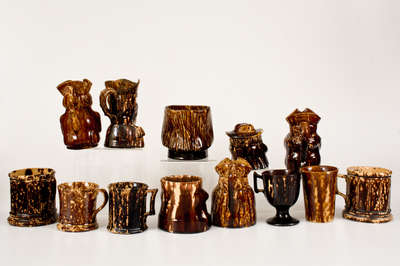 Lot of Thirteen: Rockingham Ware Cups and Molded Figural Vessels