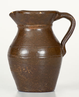Miniature Albany Slip Glazed Stoneware Pitcher Inscribed