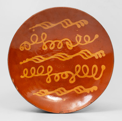 Fine Redware Charger w/ Looping Yellow Slip Decoration, probably Pennsylvania