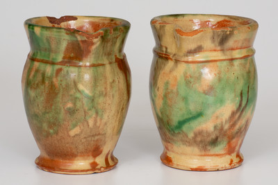Rare Pair of Multi-Glazed Redware Cream Pitchers, attributed to S. Bell & Sons or J. Eberly & Co., Strasburg, VA, circa 1890.