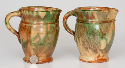Rare Pair of Multi-Glazed Redware Cream Pitchers, attributed to S. Bell & Sons or J. Eberly & Co., Strasburg, VA, circa 1890.