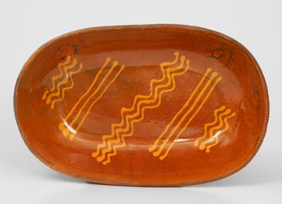 Slip-Decorated Redware Loaf Dish, PA or NJ origin, 19th century