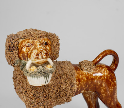 Flint Enamel Figure of a Dog w/ Basket, attrib. Lyman, Fenton & Co., Bennington, VT, circa 1849-1852