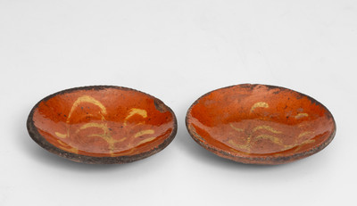 Scarce Pair of Slip-Decorated Pennsylvania Redware Tart Plates, 19th century