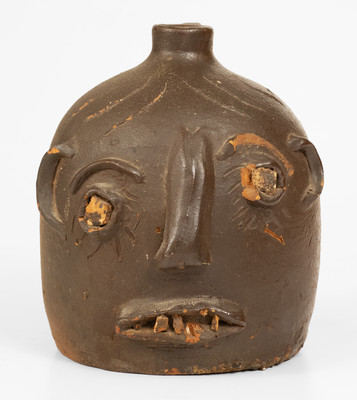 Scarce Glazed Stoneware Face Jug w/ Rock Eyes and Teeth, attrib. Casey Meaders, GA or NC origin, early 20th century