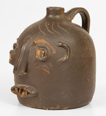 Scarce Glazed Stoneware Face Jug w/ Rock Eyes and Teeth, attrib. Casey Meaders, GA or NC origin, early 20th century