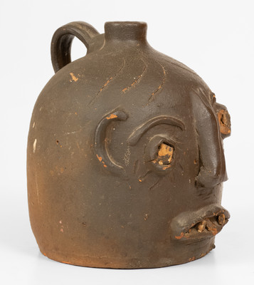 Scarce Glazed Stoneware Face Jug w/ Rock Eyes and Teeth, attrib. Casey Meaders, GA or NC origin, early 20th century