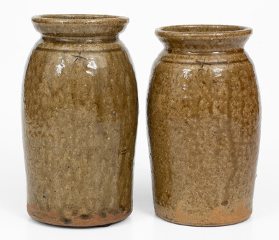 Pair of Alkaline-Glazed Stoneware Canning Jars, Incised