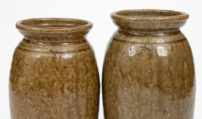 Pair of Alkaline-Glazed Stoneware Canning Jars, Incised 