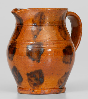 Fine Miniature Redware Pitcher with Profuse Manganese Decoration