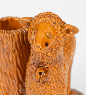 Rare Glazed Pennsylvania Redware Figure of a Sheep with Stump