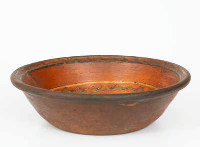 Unusual Slip-Decorated Redware Bowl Marked "J. M.," PA or possibly Southern United States