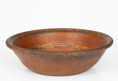Unusual Slip-Decorated Redware Bowl Marked "J. M.," PA or possibly Southern United States