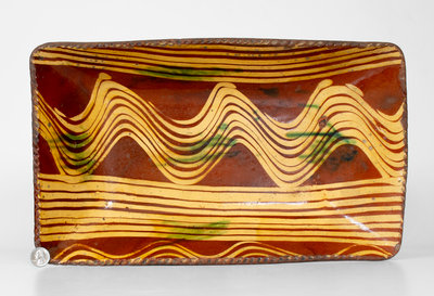 Exceptional Slip-Decorated Philadelphia Redware Loaf Dish, 18th century