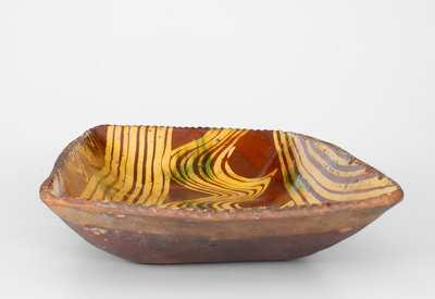 Exceptional Slip-Decorated Philadelphia Redware Loaf Dish, 18th century