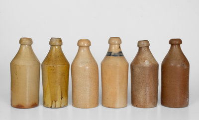 Lot of Six: Stoneware Bottles with Impressed Names