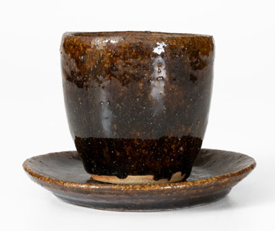 Very Rare Alkaline-Glazed Stoneware Cup and Saucer, probably Buncombe County, NC, late 19th century