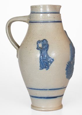 Cobalt-Decorated Stoneware Pitcher w/ Molded Stork and Human Motifs, attrib. White's Utica