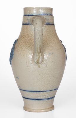 Cobalt-Decorated Stoneware Pitcher w/ Molded Stork and Human Motifs, attrib. White's Utica