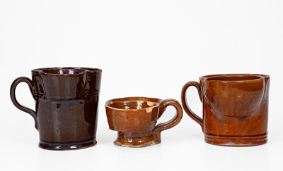 Lot of Three: Glazed Redware Shaving Mugs, American, 19th century