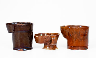 Lot of Three: Glazed Redware Shaving Mugs, American, 19th century