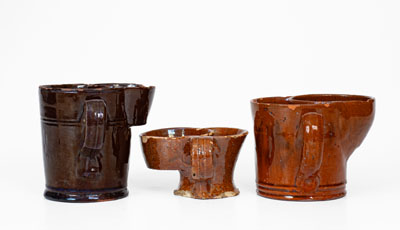 Lot of Three: Glazed Redware Shaving Mugs, American, 19th century