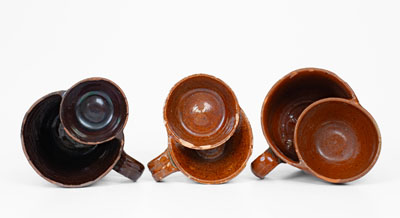 Lot of Three: Glazed Redware Shaving Mugs, American, 19th century