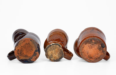 Lot of Three: Glazed Redware Shaving Mugs, American, 19th century