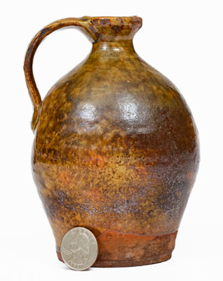 Small Glazed New England Redware Jug, late 18th or early 19th century