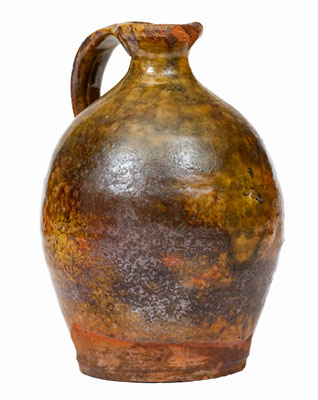 Small Glazed New England Redware Jug, late 18th or early 19th century