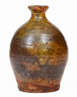 Small Glazed New England Redware Jug, late 18th or early 19th century