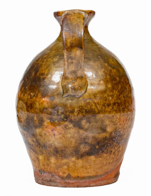 Small Glazed New England Redware Jug, late 18th or early 19th century