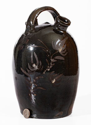 Extremely Rare Albany-Glazed Harvest Jug w/ White-Slip Floral Decoration, attrib. Hissong, Cassville, PA