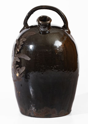 Extremely Rare Albany-Glazed Harvest Jug w/ White-Slip Floral Decoration, attrib. Hissong, Cassville, PA