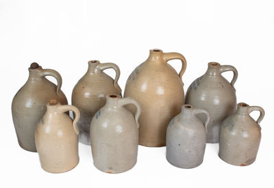 Lot of Eight: Stoneware Jugs with Impressed BOSTON Advertising