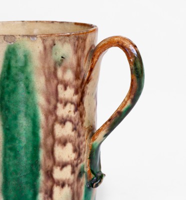 Glazed Redware Mug with Copper and Manganese Decoration, early 19th century.