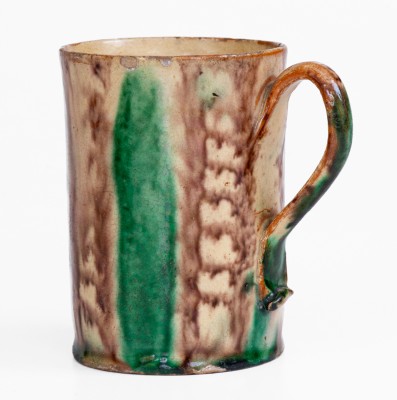 Glazed Redware Mug with Copper and Manganese Decoration, early 19th century.