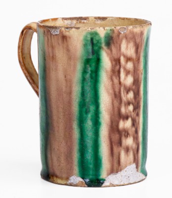 Glazed Redware Mug with Copper and Manganese Decoration, early 19th century.