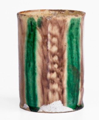 Glazed Redware Mug with Copper and Manganese Decoration, early 19th century.