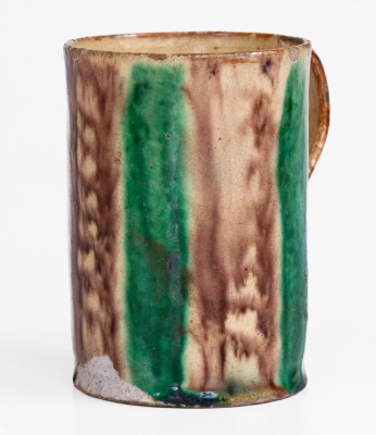 Glazed Redware Mug with Copper and Manganese Decoration, early 19th century.
