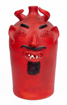 Red-Painted Pottery Devil Face Jug,