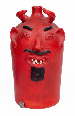 Red-Painted Pottery Devil Face Jug, 